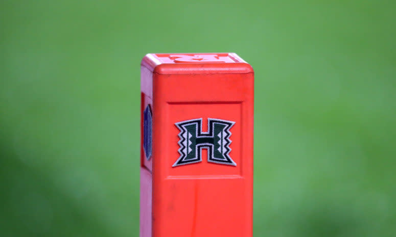 A football pylon with the University of Hawaii logo on it.