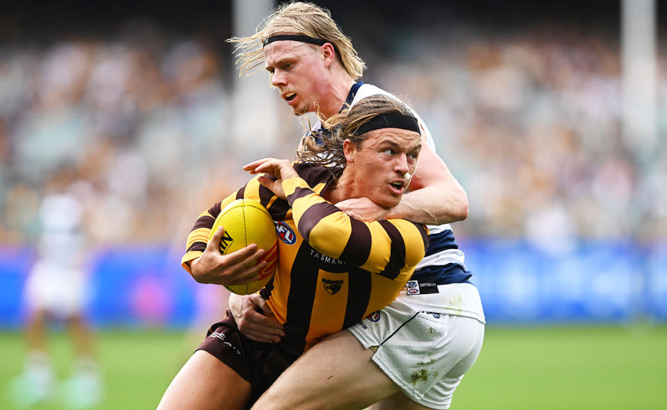 Jack Ginnivan, pictured here being contacted high in Hawthorn's clash with Geelong.