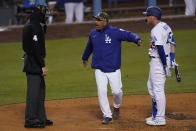 Los Angeles Dodgers manager Dave Roberts, center, gets between umpire Chad Fairchild (4) and Matt Beaty (45) after Beaty was called out on strikes during the fourth inning of a baseball game against the Miami Marlins Saturday, May 15, 2021, in Los Angeles. (AP Photo/Ashley Landis)