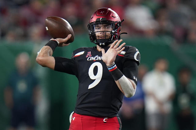 Ridder runs, passes No. 19 Cincinnati past No. 16 SMU, 42-13