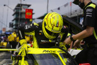 Simon Pagenaud of France climbs into his car during practice for the Indianapolis 500 auto race at Indianapolis Motor Speedway in Indianapolis, Tuesday, May 18, 2021. (AP Photo/Michael Conroy)
