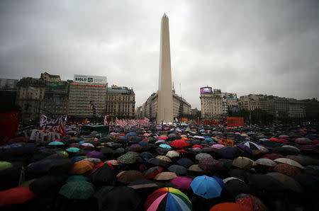 Thousands gather under the rain around Buenos Aires' Obelisk during a demonstration to demand policies to prevent gender-related violence, Argentina, October 19, 2016. REUTERS/Marcos Brindicci