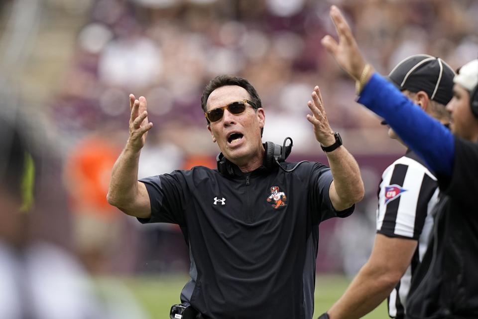 Sam Houston coach K.C. Keeler yells toward the officials during game against Texas A&M, Sept. 3, 2022, in College Station, Texas. Conference USA heads into the season in transition. In some respects, it got smaller, with six teams defecting to the American Athletic Conference. In others, it got bigger, adding large markets to show off its product. | David J. Phillip, Associated Press
