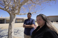 Mojave Unified School District Superintendent Katherine Aguirre, right, and Benito Luna-Herrera, a 7th-grade social studies teacher, meet with his students at California City Middle School in California City, Calif., on Friday, March 11, 2022. Since the pandemic started, experts have warned of a mental health crisis facing American children that is now visibly playing out at schools across the country. (AP Photo/Damian Dovarganes)