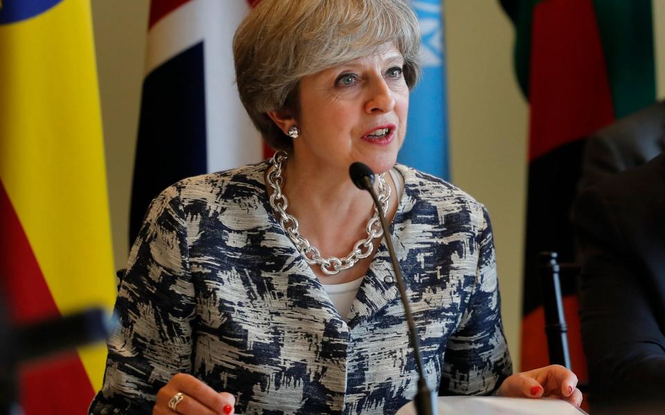 Theresa May speaking during a session on action to end forced labor, modern slavery and human trafficking in 2017 - Julie Jacobson/AP