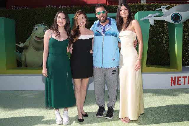 <p>Phillip Faraone/Getty Images</p> Sadie Sandler, Jackie Sandler, Adam Sandler, and Sunny Sandler