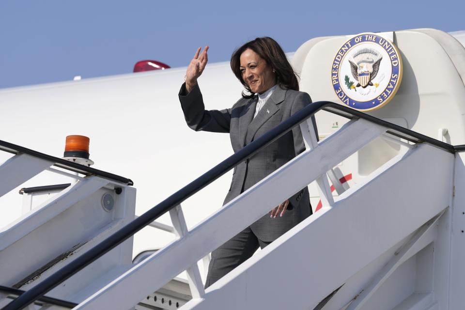 Vice President Kamala Harris waves as she arrives at Al Maktoum International Airport to attend the COP28 U.N. Climate Summit, Saturday, Dec. 2, 2023, in Dubai, United Arab Emirates. (AP Photo/Kamran Jebreili)