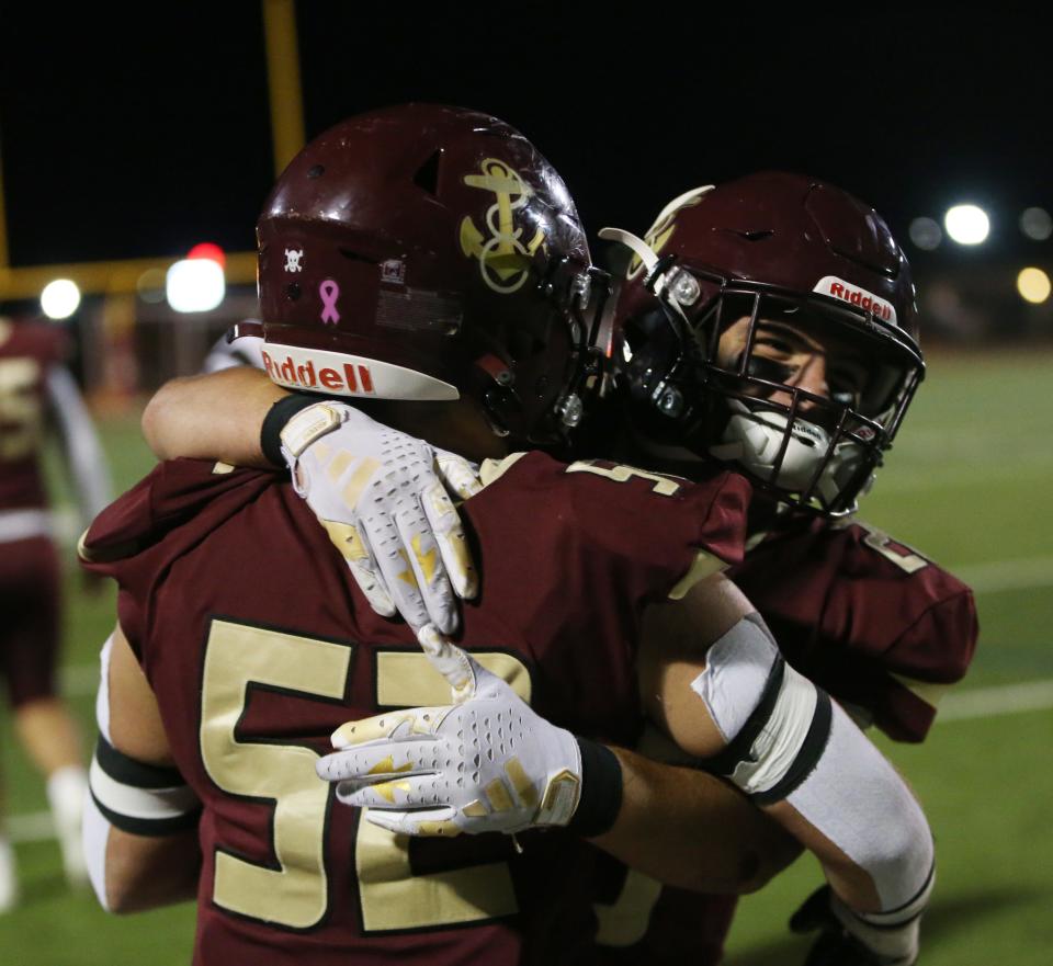 Arlington's, from left Jason Finn and Nick DeGuisto celebrate their win in Friday's Section 1 Class AA semifinal versus John Jay on November 3, 2023.