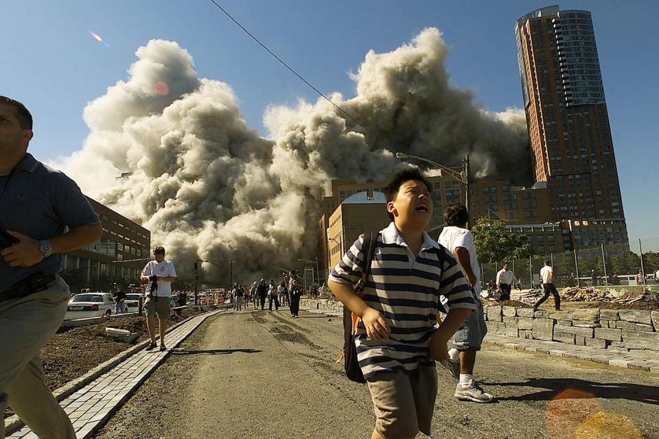 Remembering 9/11: As the north tower of the World Trade Center collapses, a cloud of toxic gas chases terrified residents and tourists. <a href="https://www.gettyimages.com/detail/news-photo/people-run-away-as-the-north-tower-of-world-trade-center-news-photo/1339533?adppopup=true" rel="nofollow noopener" target="_blank" data-ylk="slk:Jose Jimenez/Primera Hora via Getty Images;elm:context_link;itc:0;sec:content-canvas" class="link ">Jose Jimenez/Primera Hora via Getty Images</a>