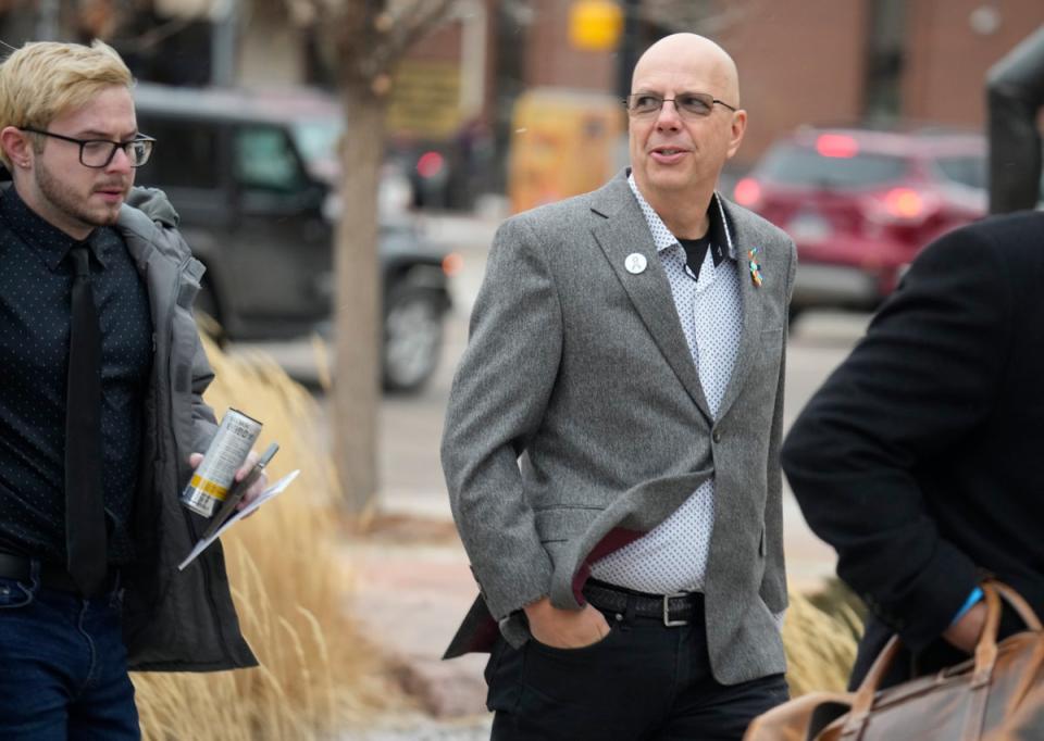 Michael Anderson, left, a survivor of the mass shooting at Club Q, walks with the club's co-owner, Matthew Haynes, into the El Paso County courthouse (AP)