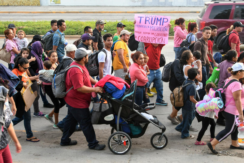 <p>Hondurans walk towards the U.S. from San Pedro Sula, 180 kms north from Tegucigalpa, on Oct. 13, 2018. (Photo: Orlando Sierra/AFP/Getty Images) </p>