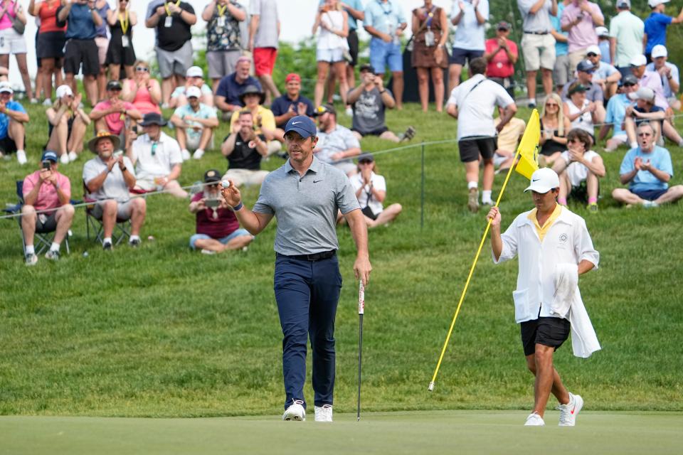 June 3, 2023; Dublin, Ohio, USA;  Rory McIlroy reacts to making a putt on 17 uring the third round of the Memorial Tournament at Muirfield Village Golf Club. 