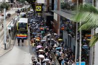 People carry umbrellas as they attend a protest in Hong Kong