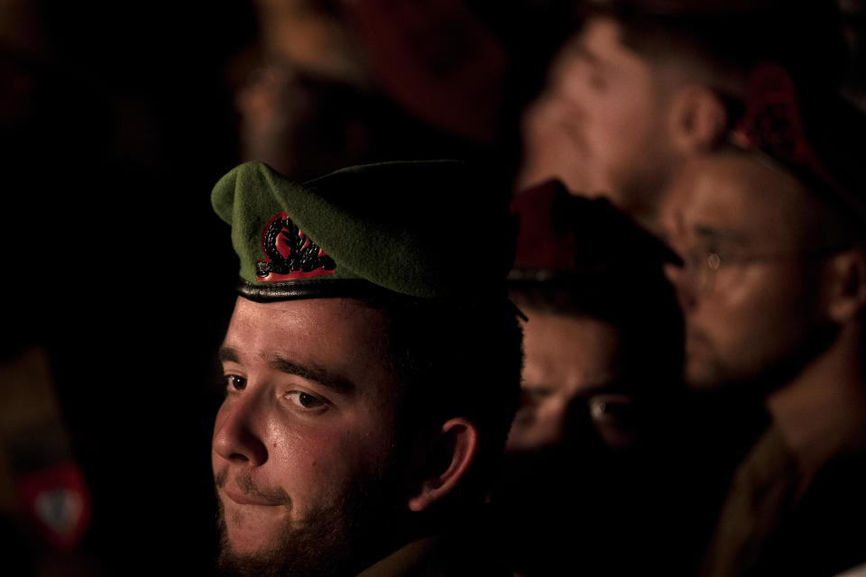 An Israeli Army soldier pauses during the funeral for Maj. Bar Falah, killed during a West Bank operation, in Netanya, Israel, Wednesday, Sept. 14, 2022. Palestinian gunmen opened fire on Israeli troops near a military checkpoint in the occupied West Bank Wednesday, killing Maj. Falah, Israel's military said. Palestinian officials said that troops killed the two gunmen.(AP Photo/ Maya Alleruzzo)