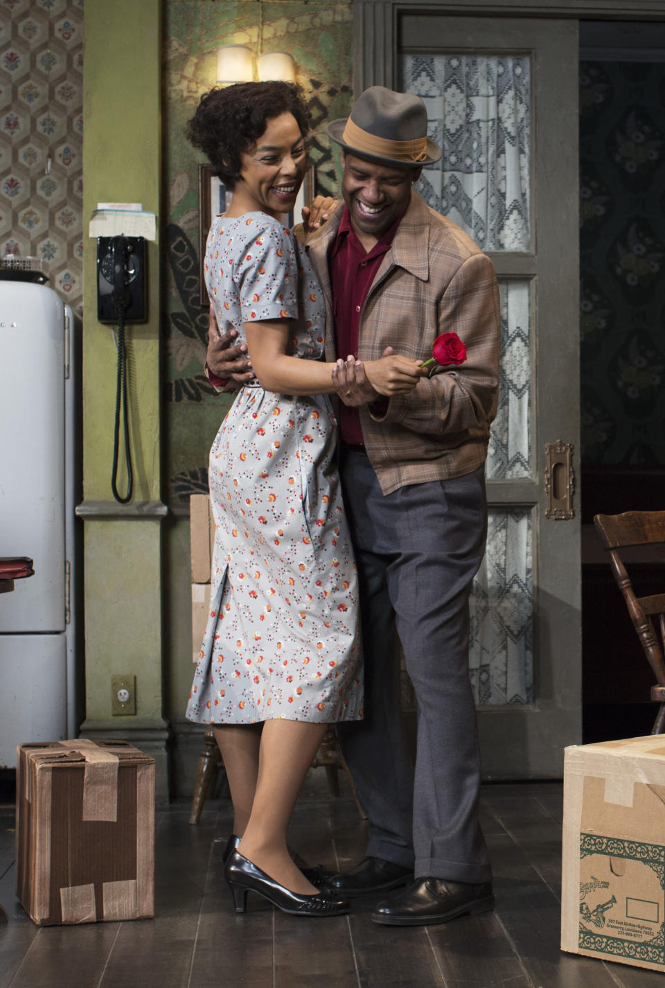 This image released by Philip Rinaldi Publicity shows Sophie Okonedo, left, and Denzel Washington during a performance of "A Raisin in the Sun," at the Ethel Barrymore Theatre in New York. (AP Photo/Philip Rinaldi Publicity, Brigitte Lacombe)