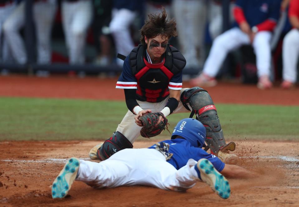 Ketcham catcher Conner Lynch (4) works to puts a tag on a Horseheads baserunner Matthew Procopio (6) during the Class AA regional semifinal baseball game at Dutchess Stadium in Wappingers Falls, on Thursday, June 2, 2022.