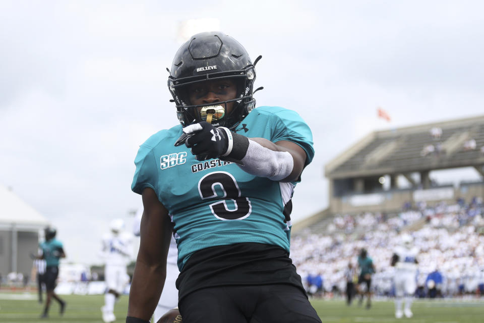 Coastal Carolina wide receiver Aaron Bedgood (3) celebrates a touchdown during the first half of a NCAA college football game against Buffalo in Buffalo, N.Y. on Saturday, Sept. 18, 2021. (AP Photo/Joshua Bessex)