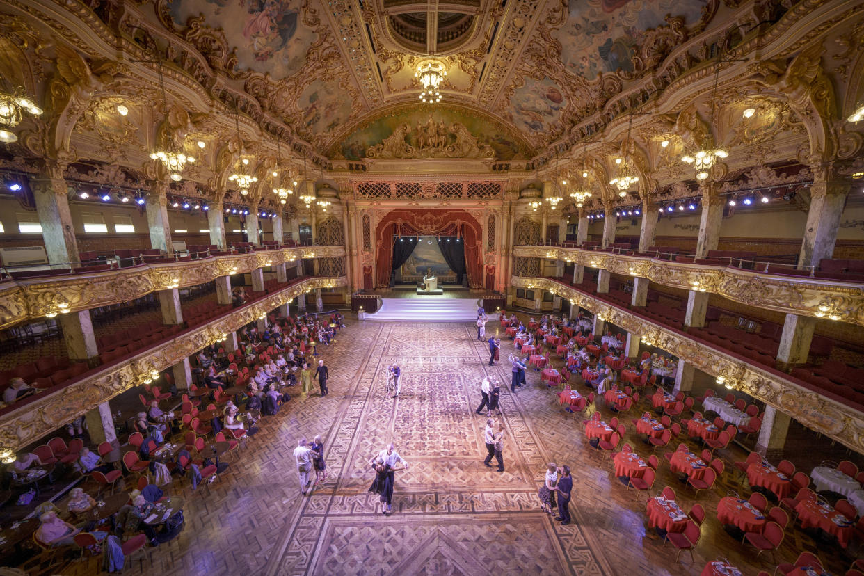 Dancers take to the famous Blackpool Tower Ballroom and move to the sound of the famous Wurlitzer organ on August 05, 2021 in Blackpool, England. The historic ballroom, familiar to British TV viewers as the home of Strictly Come Dancing's annual ballroom special, reopened in July after closing last spring due to the Covid-19 pandemic. (Photo by Christopher Furlong/Getty Images)