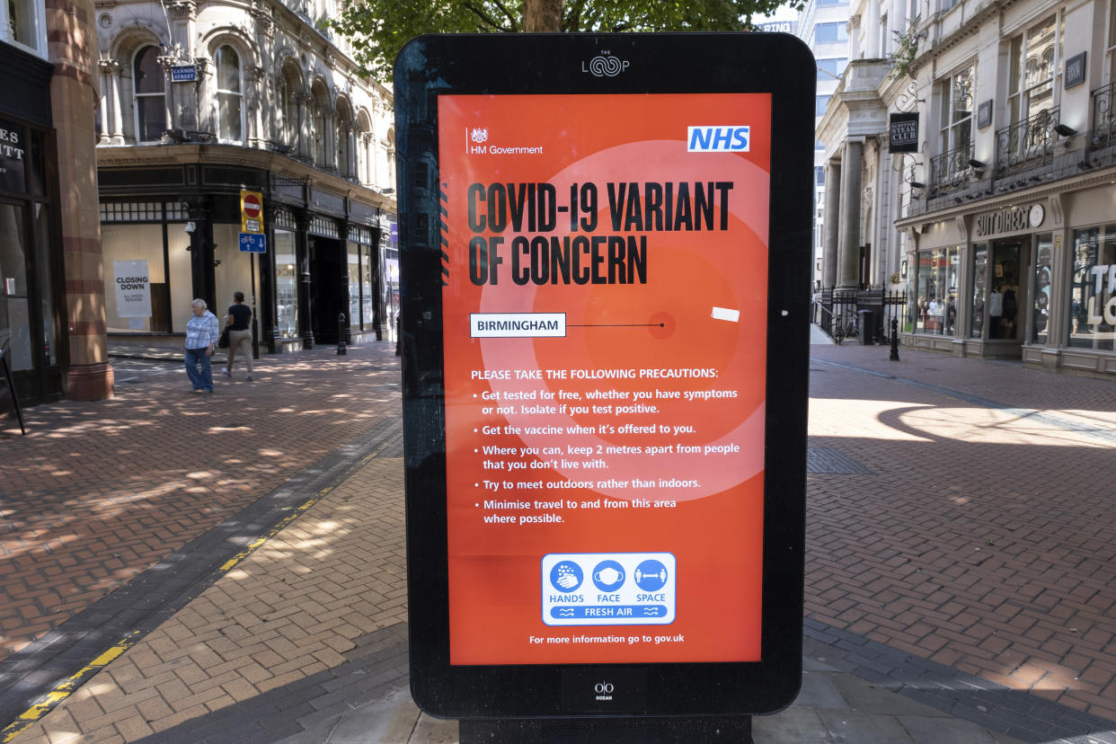 Covid-19 variant of concern public health NHS advertising board with just five more days to the official 'freedom day' planned for the 19th July, people, many of whom are wearing face masks, come to the city centre retail shopping district on 14th July 2021 in Birmingham, United Kingdom. After months of lockdown, but with case numbers rising, in particular that of the Delta Variant, there is hope that life will start to return to normal, with restrictions like the compulsory wearing of face coverings in public spaces ending. (photo by Mike Kemp/In Pictures via Getty Images)