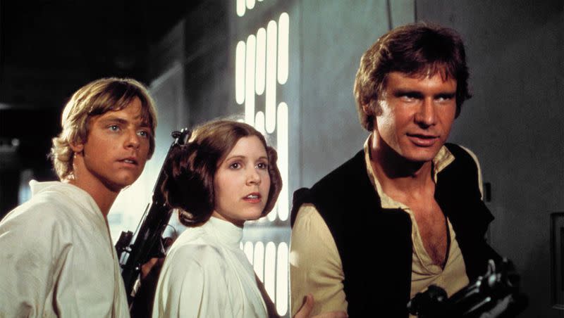 Luke Skywalker (Mark Hamill), Princess Leia (Carrie Fisher) and Han Solo (Harrison Ford) escape from the Death Star in “Star Wars: Episode IV A New Hope.”