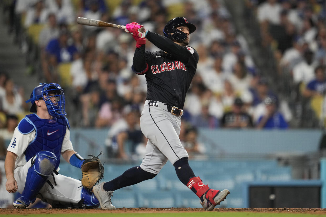 Cleveland Guardians' Andrés Giménez hits a home run during the sixth inning of a baseball game against the Los Angeles Dodgers in Los Angeles, Friday, Sept. 6, 2024. Brayan Rocchio also scored. (AP Photo/Ashley Landis)