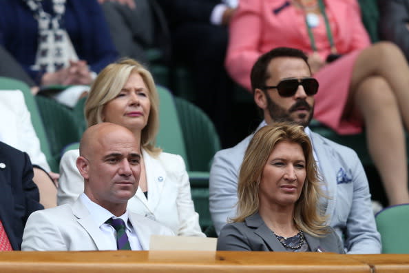 Andre Agassi and Stefanie Graf look on from the Royal Box on Centre Court during day nine of the Wimbledon Lawn Tennis Championships at the All England Lawn Tennis and Croquet Club on July 4, 2012 in London, England. (Photo by Clive Rose/Getty Images)