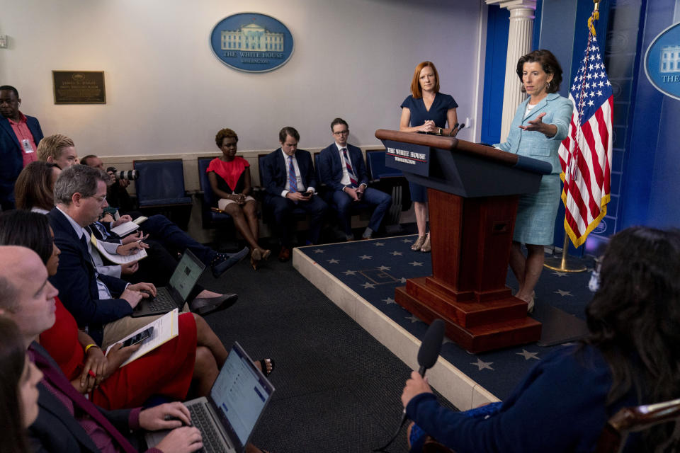 Commerce Secretary Gina Raimondo, accompanied by White House press secretary Jen Psaki, second from right, speaks during a press briefing in the briefing room of the White House in Washington, Thursday, July 22, 2021. (AP Photo/Andrew Harnik)