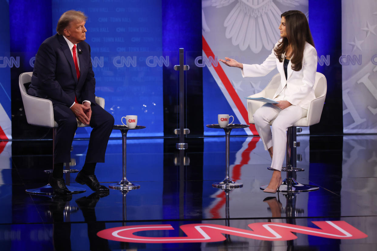 Donald Trump listens to CNN's Kaitlan Collins during a town hall in Manchester, N.H., on Tuesday.