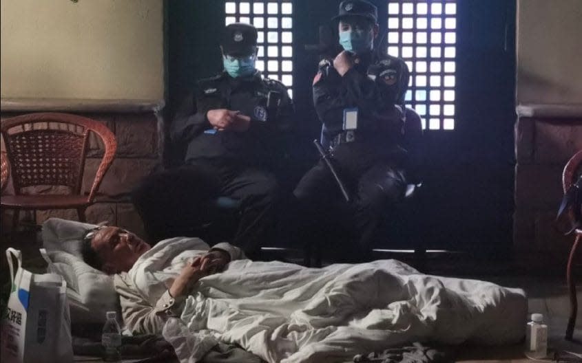 Prof Zhang Yongzhen slept the night outside the centre in Shanghai after he begged authorities to let him continue his work