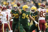 Green Bay Packers' Dean Lowry celebrates a fumble recovery during the second half of an NFL football game against the Washington Football Team Sunday, Oct. 24, 2021, in Green Bay, Wis. (AP Photo/Matt Ludtke)