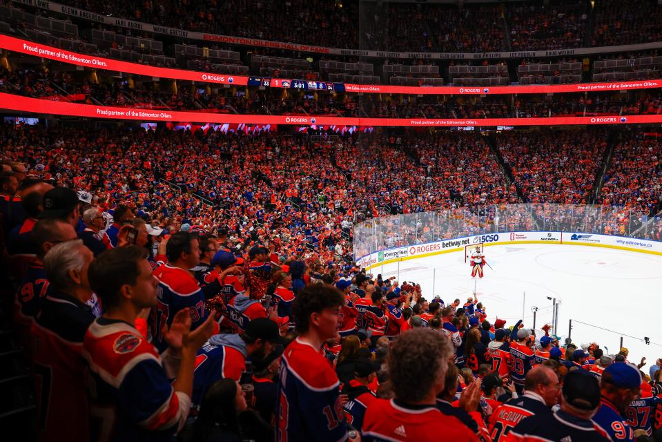 Edmonton Oilers fans are decked out in their hockey jerseys while watching Game 4 of the Stanley Cup Final on June 15 against the Florida Panthers.