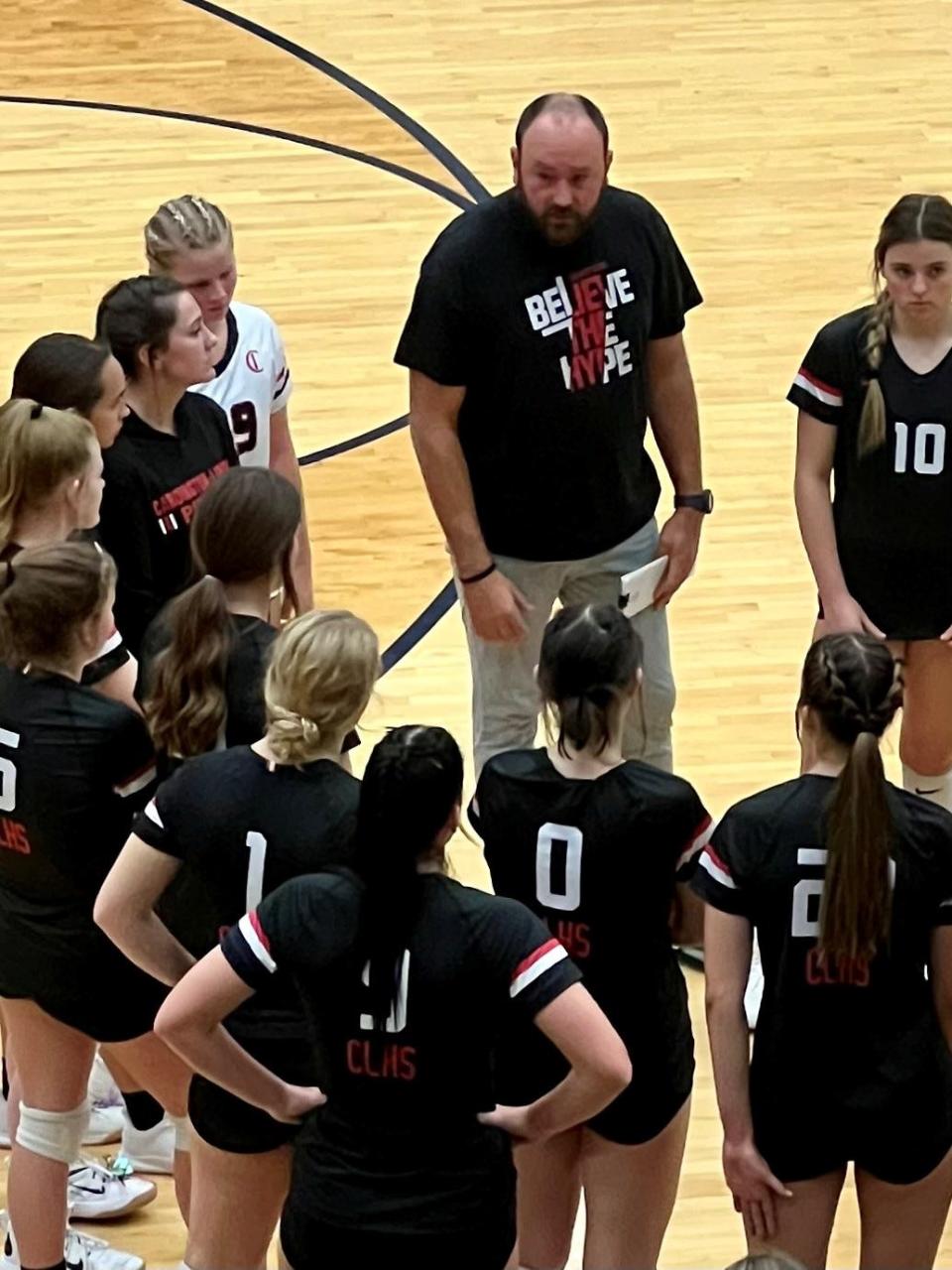 Cardington coach Ryan Treese talks to his team during a timeout at the Division III volleyball regional semifinal at Kettering Fairmont's Trent Arena last year.