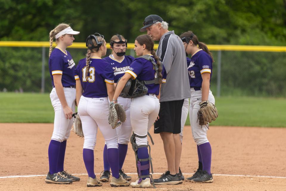 Chargers head coach David Quinn meets with his team during the top of the 4th inning during OLSH's first round matchup in the WPIAL Class 2A playoffs against Steel Valley Tuesday afternoon at North Allegheny High School.