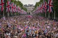People pack the Mall as the British Royal family come onto the balcony of Buckingham Place after the Trooping the Color ceremony in London, Thursday, June 2, 2022, on the first of four days of celebrations to mark the Platinum Jubilee. (Aaron Chown/Pool Photo via AP)