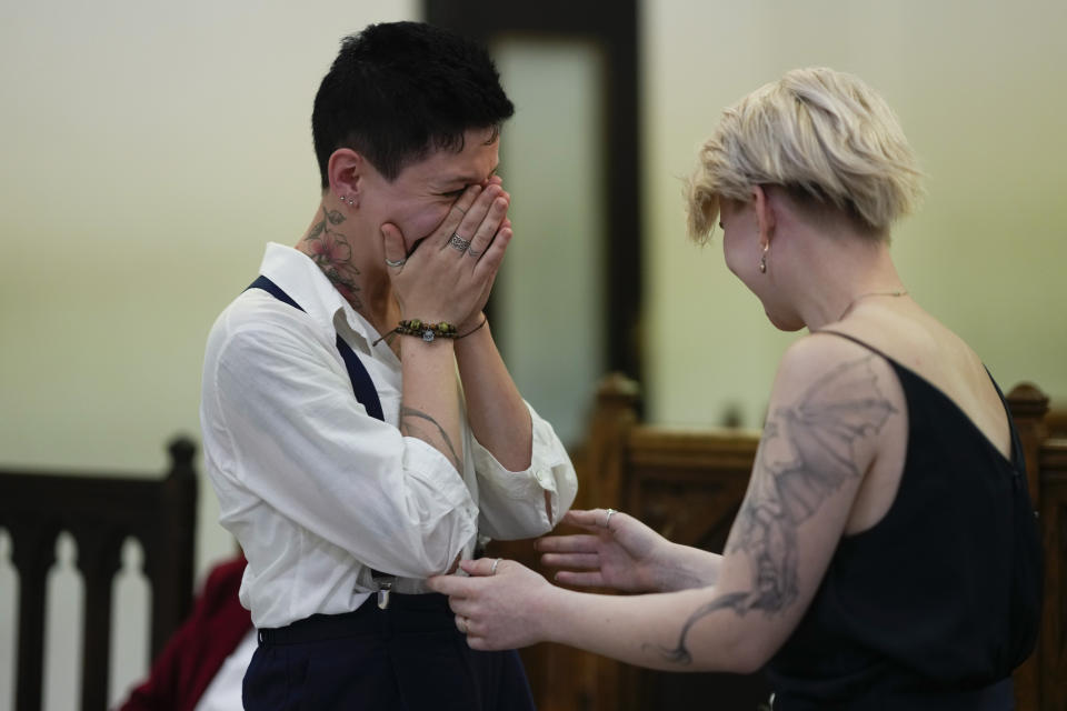 Newlyweds Tatiana Skvortosova, left, and Nadezhda Skvortosova, both Russian nationals, react as a judge declares them wives at a civil registry in Buenos Aires, Argentina, Friday, April 28, 2023. “It’s a very important moment for us. We’re waiting for very long to be officially family,” said Nadezhda Skvortosova. Living openly as a member of the LGBTQ+ community in Russia has grown increasingly difficult over the past decade and the country explicitly outlawed same-sex marriages in 2020. (AP Photo/Natacha Pisarenko)