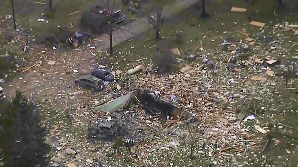 This image from video shows the remains of a house scattered after an explosion in Northfield Township, Mich., on Saturday Dec. 30, 2023. Several were killed and injured.