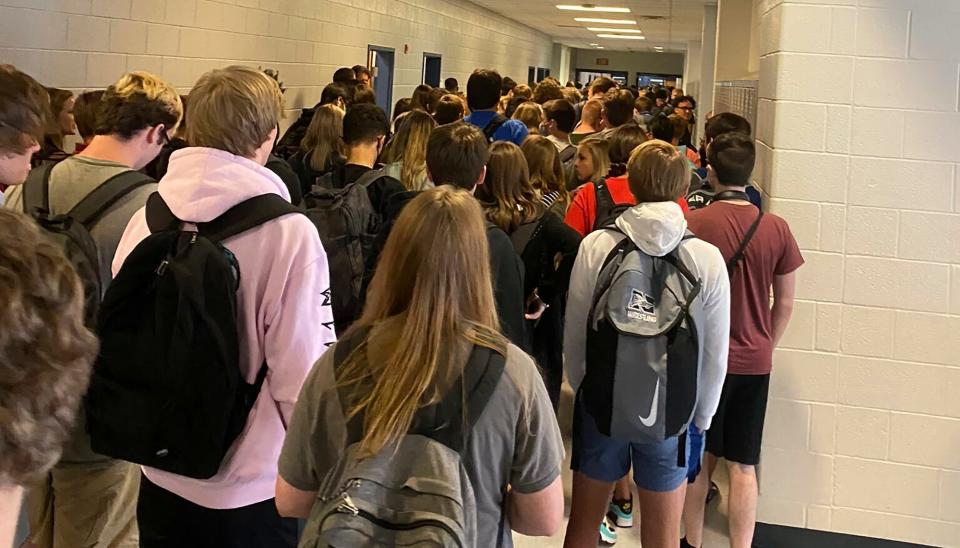 In this photo posted on Twitter, students crowd a hallway, Tuesday, Aug. 4, 2020, at North Paulding High School in Dallas, Ga.