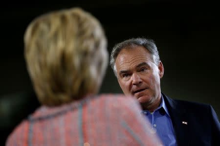 Democratic U.S. presidential candidate Hillary Clinton and U.S. Senator Tim Kaine (D-VA) attend a campaign rally at Ernst Community Cultural Center in Annandale, Virginia, U.S., July 14, 2016. REUTERS/Carlos Barria