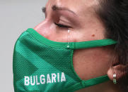 <p>Silver Medalist Antoaneta Kostadinova of Bulgaria sheds a tear during the July 25 medal ceremony of the 10m air pistol women's event on July 25. </p>