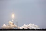 A SpaceX rocket Dargon cargo ship lifts off from launch complex 40 at the Cape Canaveral Air Force Station in Cape Canaveral, Fla., Friday, April 18, 2014. The rocket will deliver research equipment, food and other supplies to the International Space Station. (AP Photo/John Raoux)