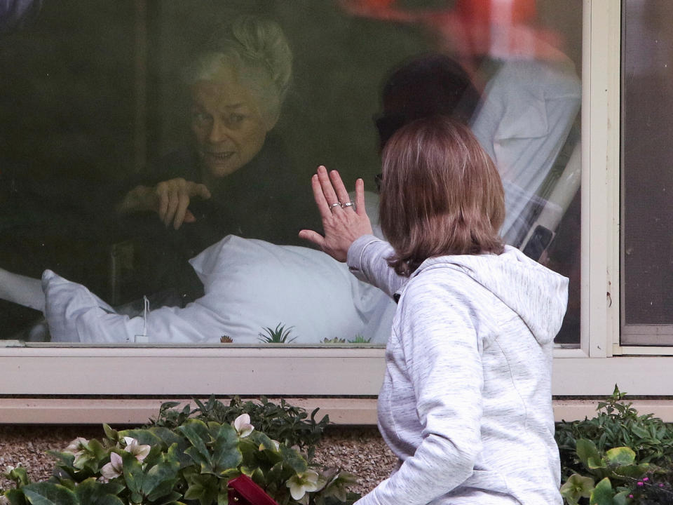 Lori Spencer visits her mom Judie Shape, 81, who Spencer says has tested positive for coronavirus, at Life Care Center of Kirkland, the Seattle-area nursing home at the epicenter of one of the biggest coronavirus outbreaks in the United States, in Kirkland, Washington, U.S. March 11, 2020.  REUTERS/Jason Redmond     TPX IMAGES OF THE DAY