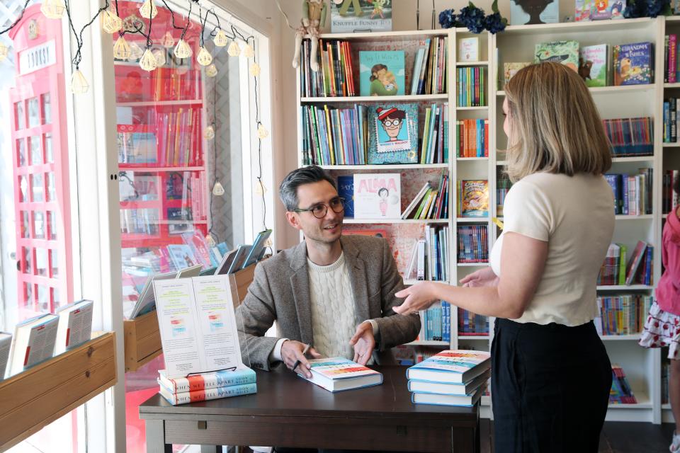 Nyack native Soon Wiley signs a copy of his debut novel "When We Fell Apart" at Booksy Galore in Pound Ridge April 30, 2022. The book is getting over-the-top buzz in the publishing world.