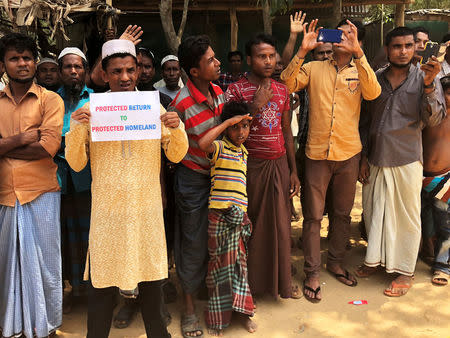 Rohingya refugees line the streets as United Nations Security Council convoy passes by, outside Kutupalong Refugee Camp in Cox's Bazar, Bangladesh, April 29, 2018. REUTERS/Kevin Fogarty