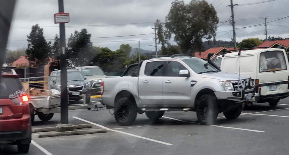 Pictured is ute and trailer taking up several parking bays.