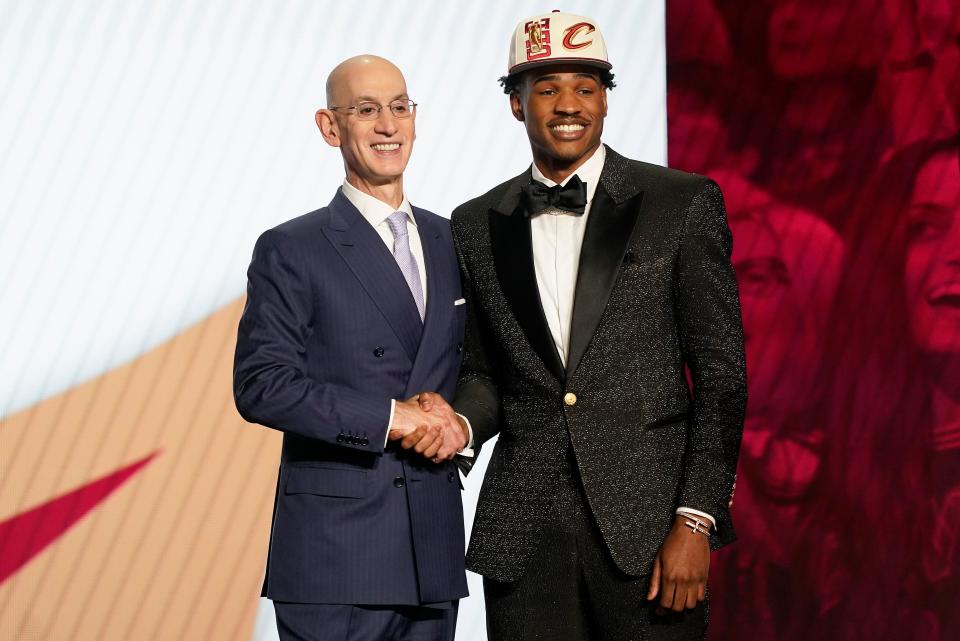Ochai Agbaji is congratulated by NBA Commissioner Adam Silver after being selected 14th overall by the Cleveland Cavaliers in the NBA draft on June 23, 2022, in New York. Agbaji played his collegiate career at Kansas.