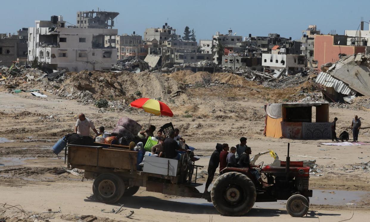 <span>Internally displaced Palestinians carry their belongings on Tuesday after the Israeli army asked them to evacuate from Rafah.</span><span>Photograph: APAImages/Rex/Shutterstock</span>