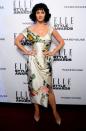 <p>La chanteuse était particulièrement féminine vêtue d'une tenue à fleurs Vivienne Westwood lors des Elle Style Awards en 2014. [<i>Photo : Getty</i>]</p>