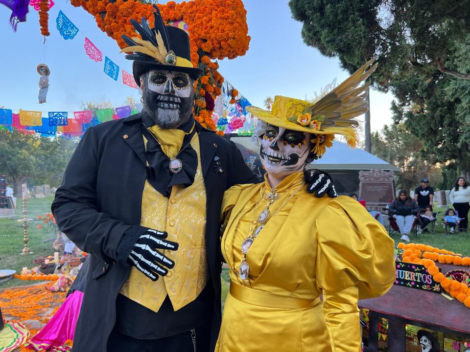 Brian and Alyssa Davis of Los Angeles pose at the Día de Los Muertos celebration at the Hollywood Forever Cemetery in Los Angeles on Saturday, Oct. 28, 2023.