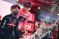 Britain’s Tao Geoghegan Hart celebrates with teammates after winning the Giro d'Italia cycling race, in Milan, Italy, Sunday, Oct. 25, 2020. In one of the most exciting final stages of a Grand Tour, British rider Tao Geoghegan Hart won the Giro d’Italia on Sunday, edging out Australian Jai Hindley by just 39 seconds. (Marco Alpozzi/LaPresse via AP)