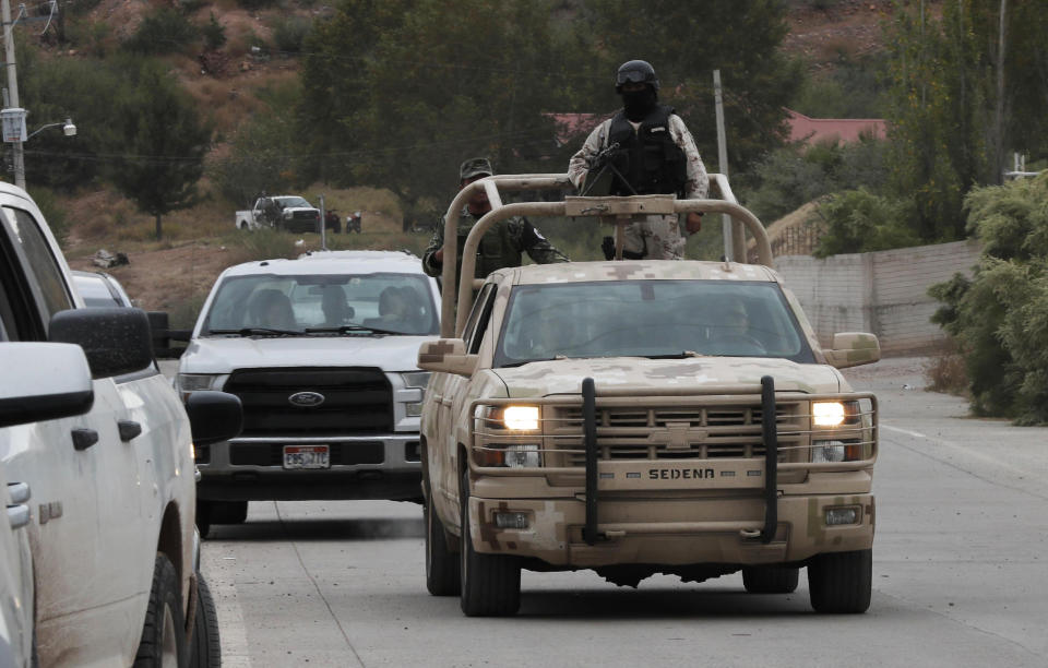 Soldiers patrol La Mora as the community prepares to hold the first funerals for some of the women and children from the extended LeBaroon family who were killed by drug cartel gunmen, in La Mora, Sonora state, Mexico, Thursday, Nov. 7, 2019. Three women and six of their children were gunned down in an attack while traveling along Mexico&#39;s Chihuahua and Sonora state border on Monday. (AP Photo/Marco Ugarte)